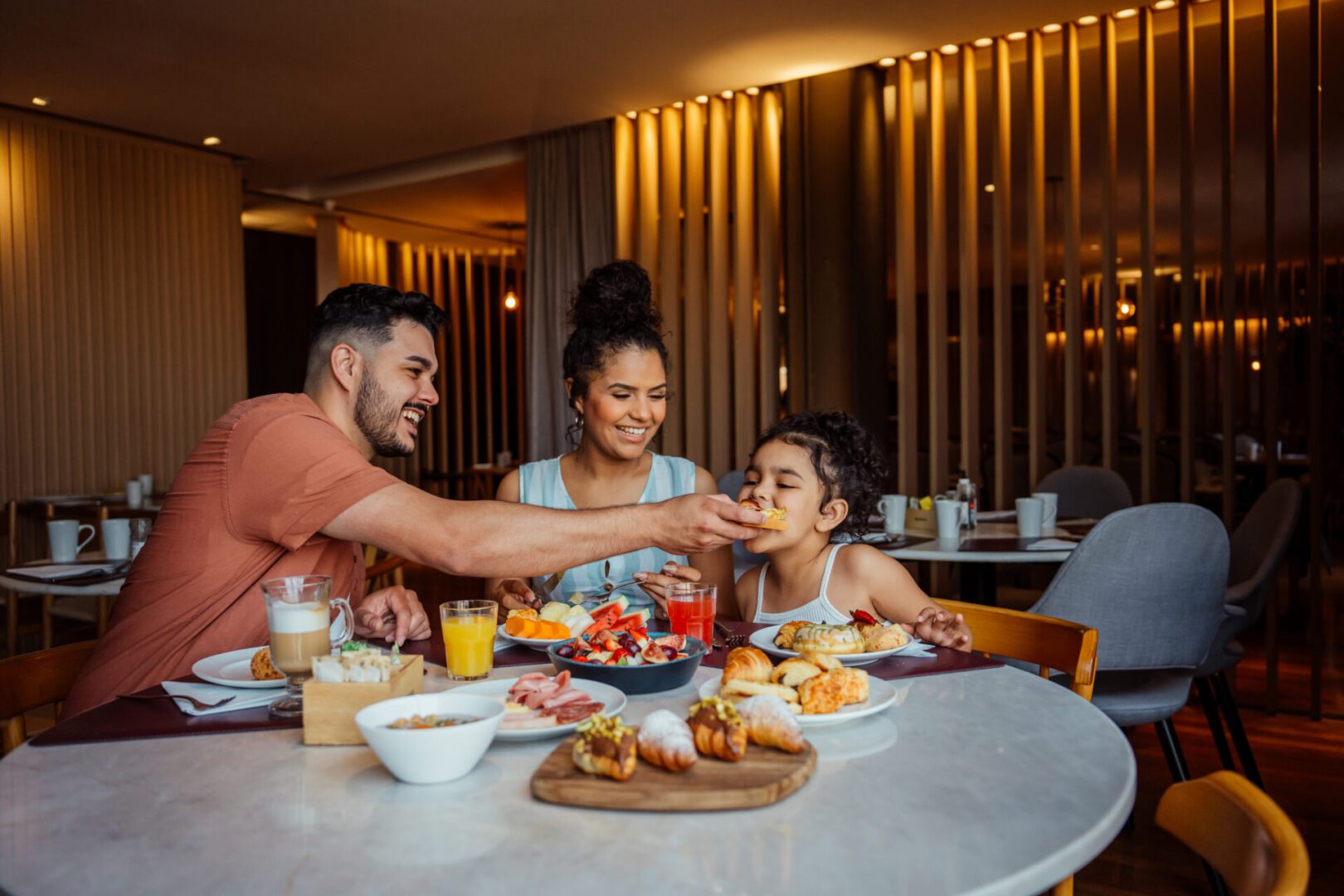 Smiling family sharing a meal