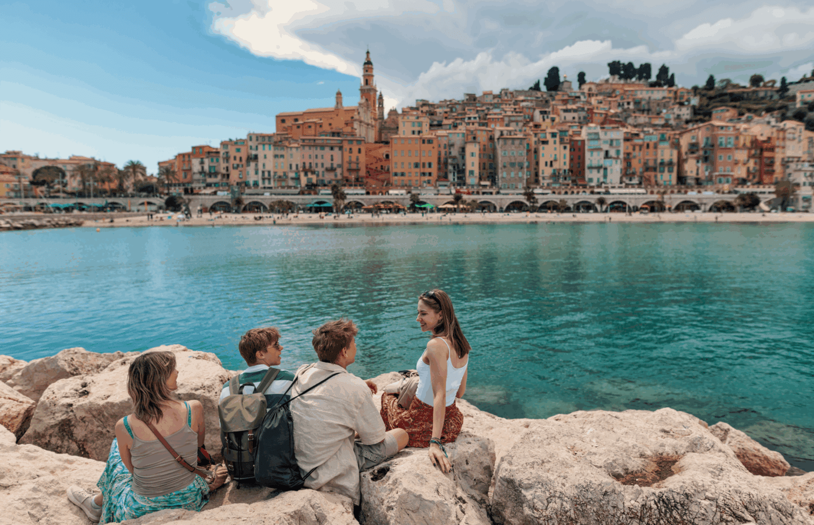 Family enjoying seaside view of colorful town