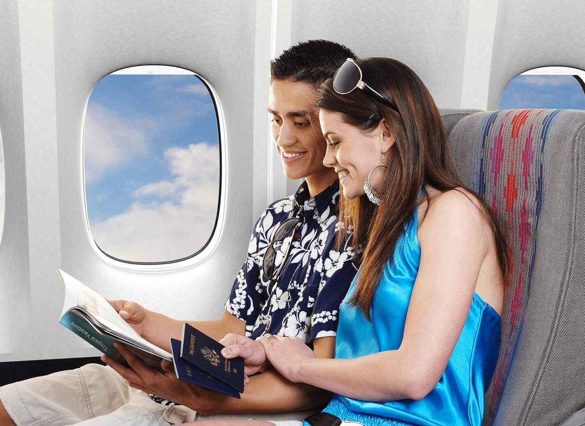Couple reading on airplane